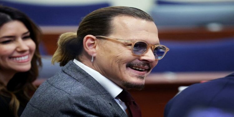 Johnny Depp laughs in court as Amber Heard calls him ‘Junkie Johnny’